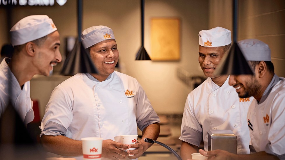 Staff standing in restaurant talking